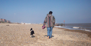 Anita Walking Rosie The Border Collie On Lowestoft Beach